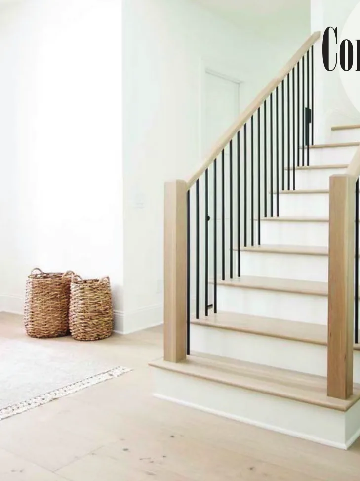 Contemporary staircase with square oak newels and slim black iron balusters