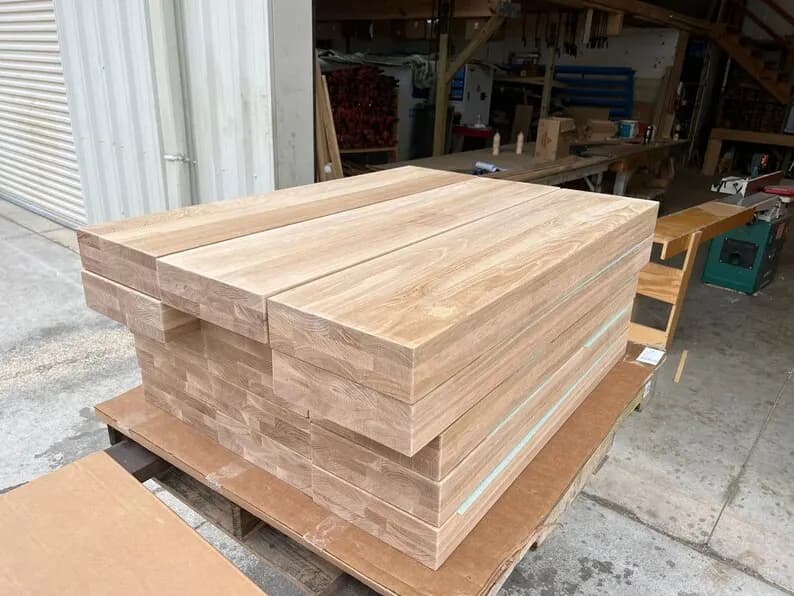 Freshly milled stair treads stacked on a pallet in the Whitehall shop